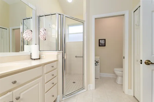 a bathroom with a shower sink and toilet