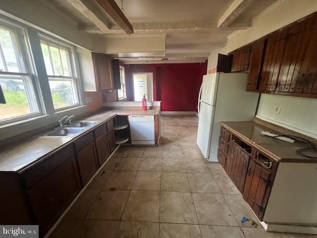 18506 Triangle Street Triangle, VA 22172 - Photo 18 of 19 a kitchen with stainless steel appliances granite countertop a sink stove and refrigerator