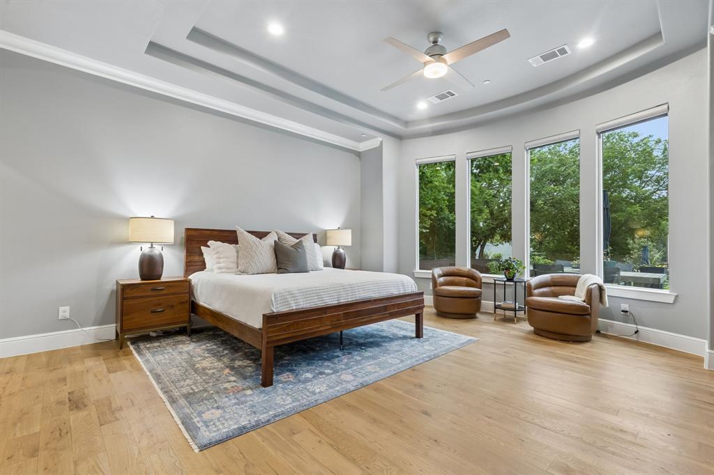 6700 Herbert Road Colleyville, TX 76034 - Photo 5 of 32 a bedroom with a bed and large windows