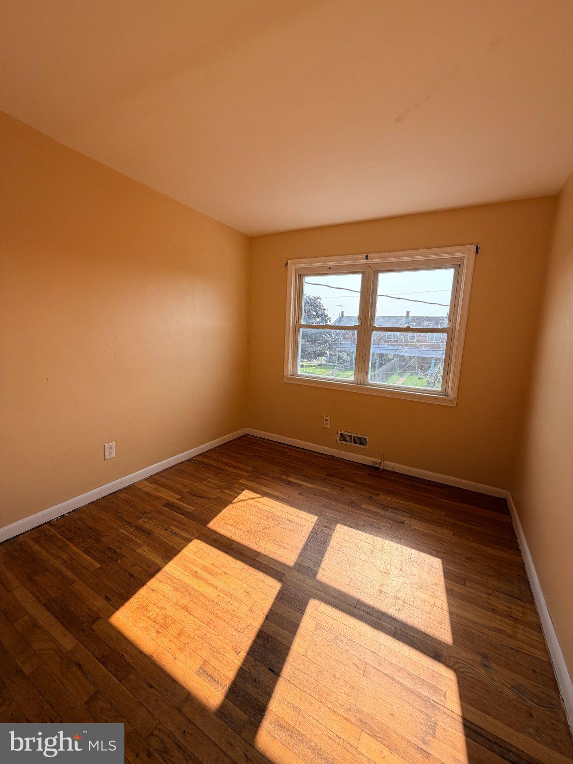 1707 Stokesley Road Baltimore, MD 21222 - Photo 15 of 18 Sunlit room with warm, inviting hues.