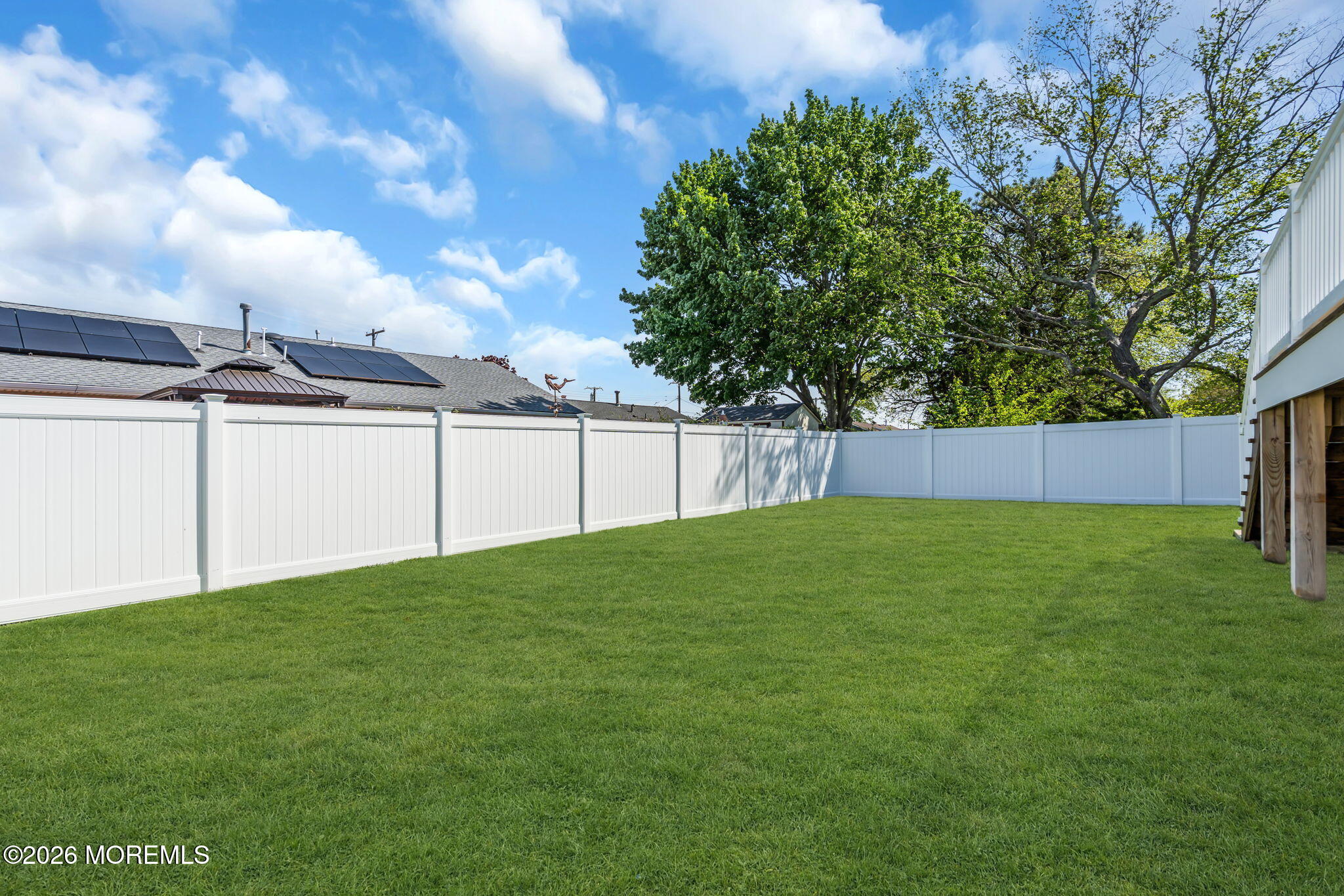 312 Beach Boulevard Forked River, NJ 08731 - Photo 36 of 40 a view of a backyard with grass and a garage