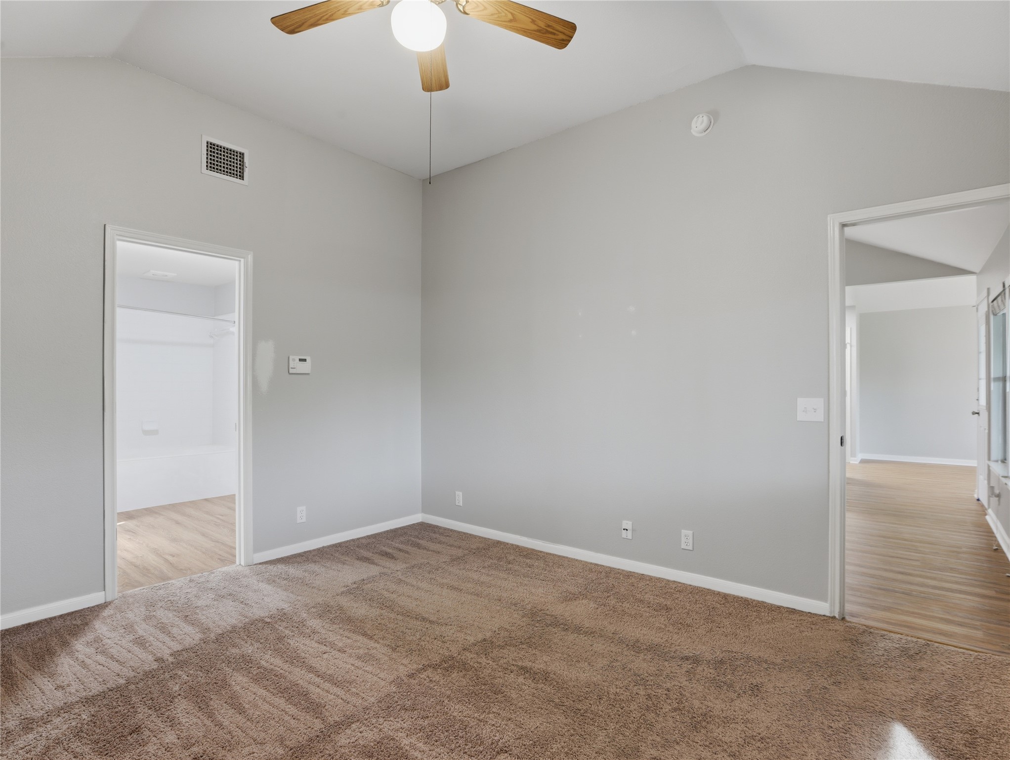 168 Keystone Loop Kyle, TX 78640 - Photo 14 of 23 Unfurnished room with a ceiling fan and light carpet