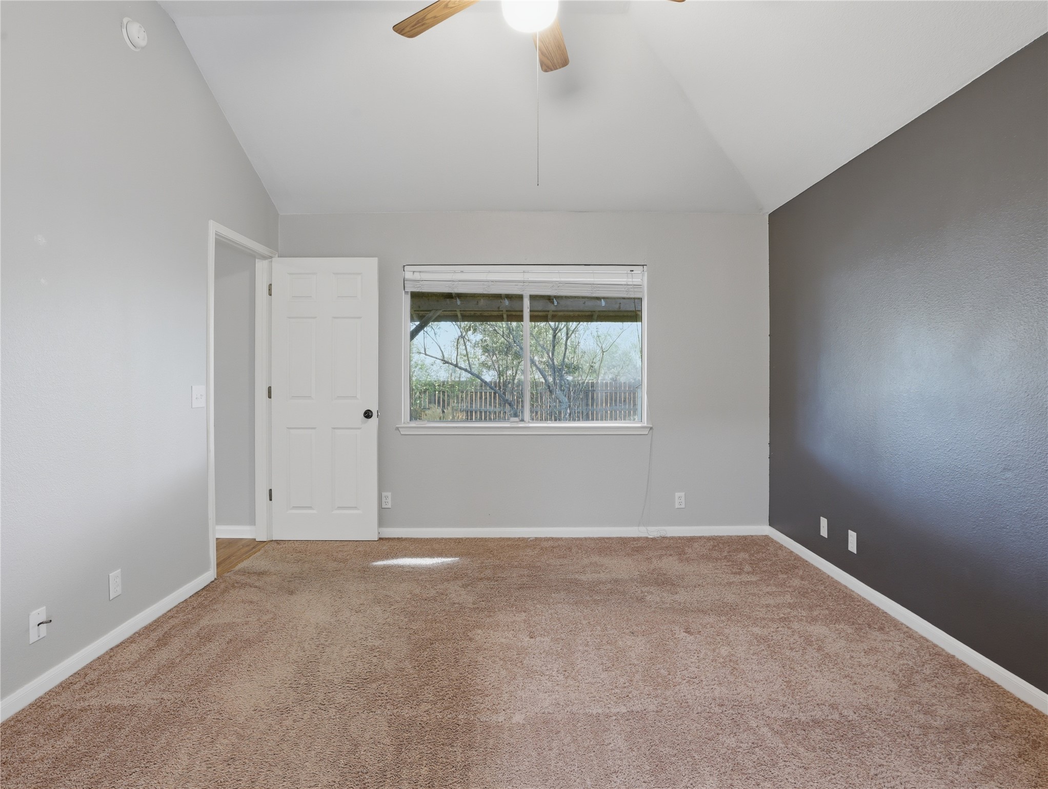 168 Keystone Loop Kyle, TX 78640 - Photo 10 of 23 Carpeted empty room with a ceiling fan and lofted ceiling