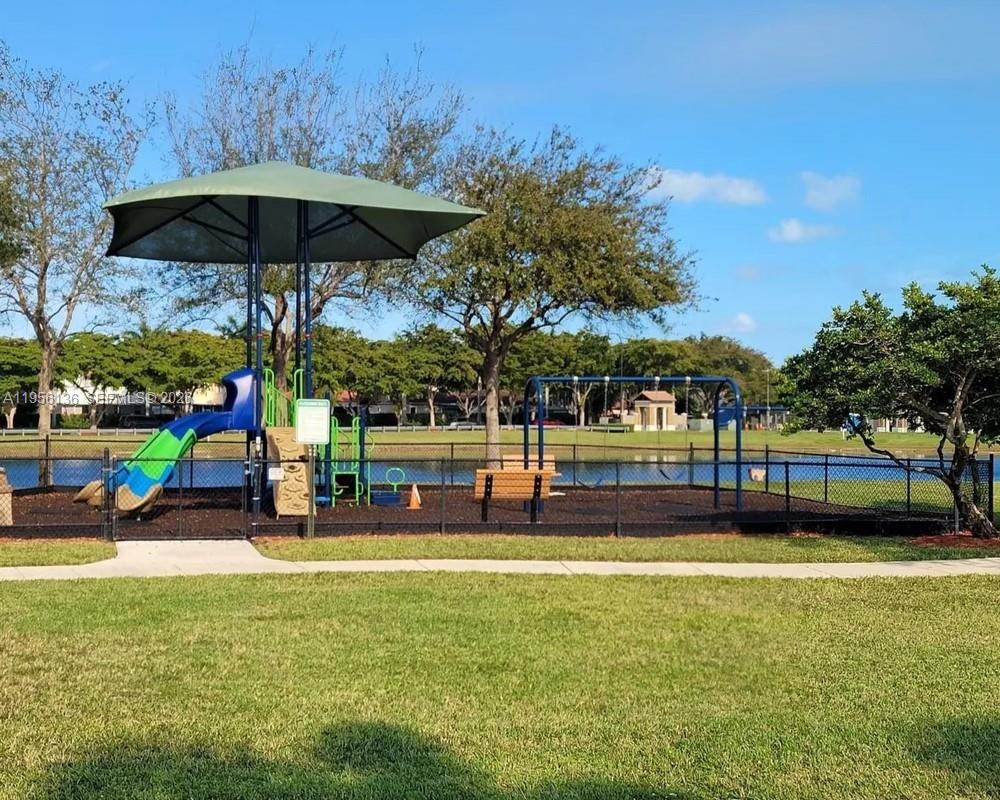 22441 Southwest 88th Place, Unit 2015 Cutler Bay, FL 33190 - Photo 17 of 19 a view of swimming pool with outdoor seating and yard