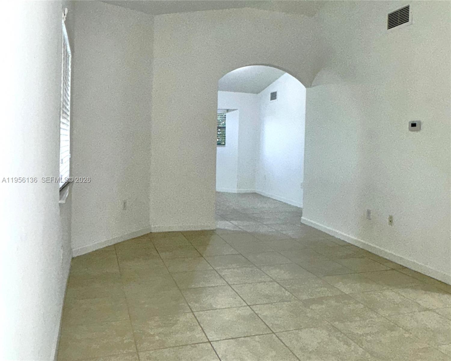 22441 Southwest 88th Place, Unit 2015 Cutler Bay, FL 33190 - Photo 5 of 19 an empty room with a bathroom