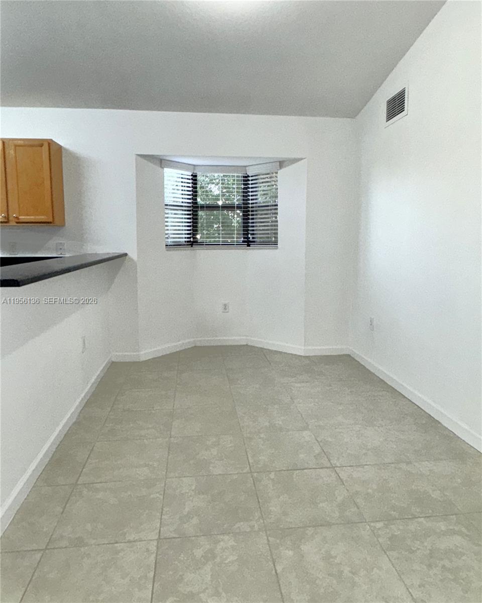 22441 Southwest 88th Place, Unit 2015 Cutler Bay, FL 33190 - Photo 6 of 19 a view of a room that has a window in it