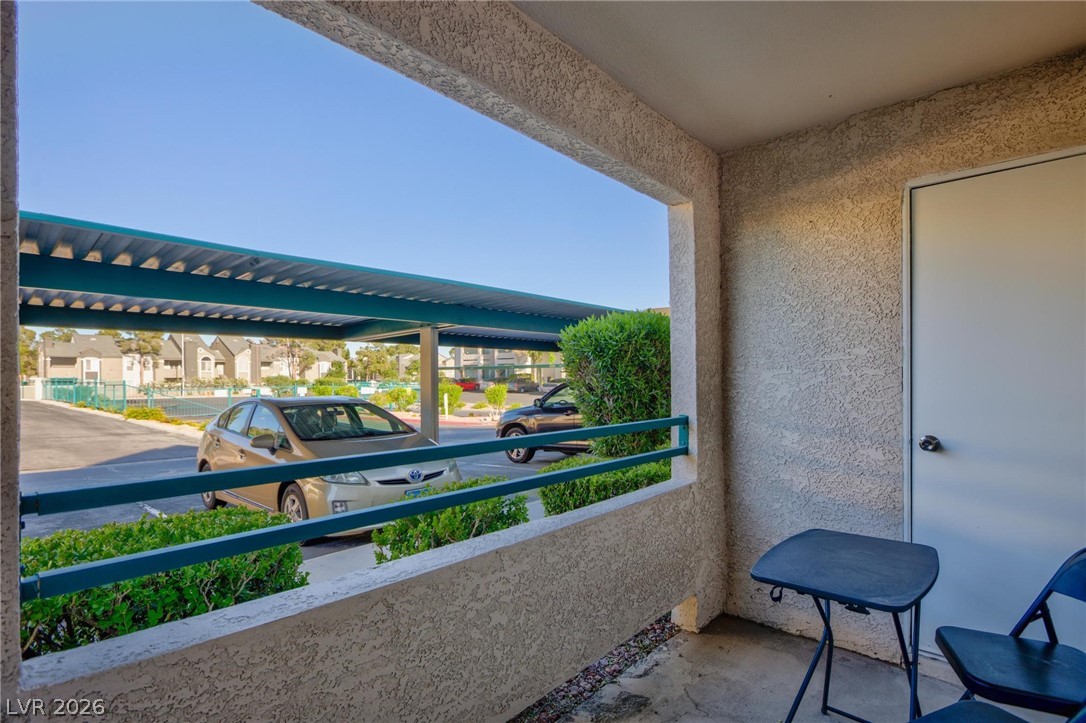 5171 South Lindell Road, Unit 103 Las Vegas, NV 89118 - Photo 7 of 24 A well-maintained outdoor patio area offers views of the community's convenient covered parking.