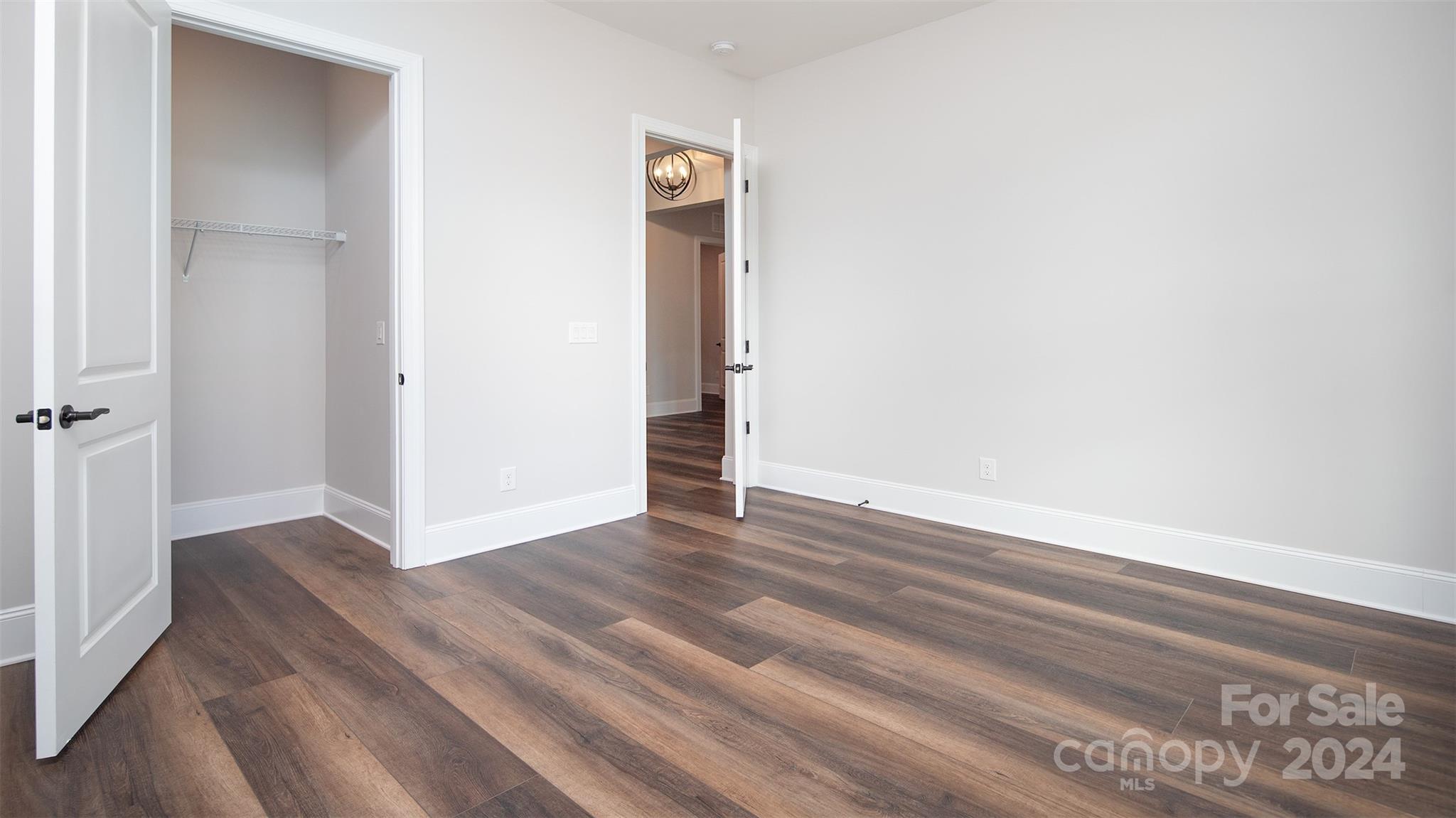 2002 Lake Como Drive Monroe, NC 28110 - Photo 15 of 40 a view of an empty room with wooden floor