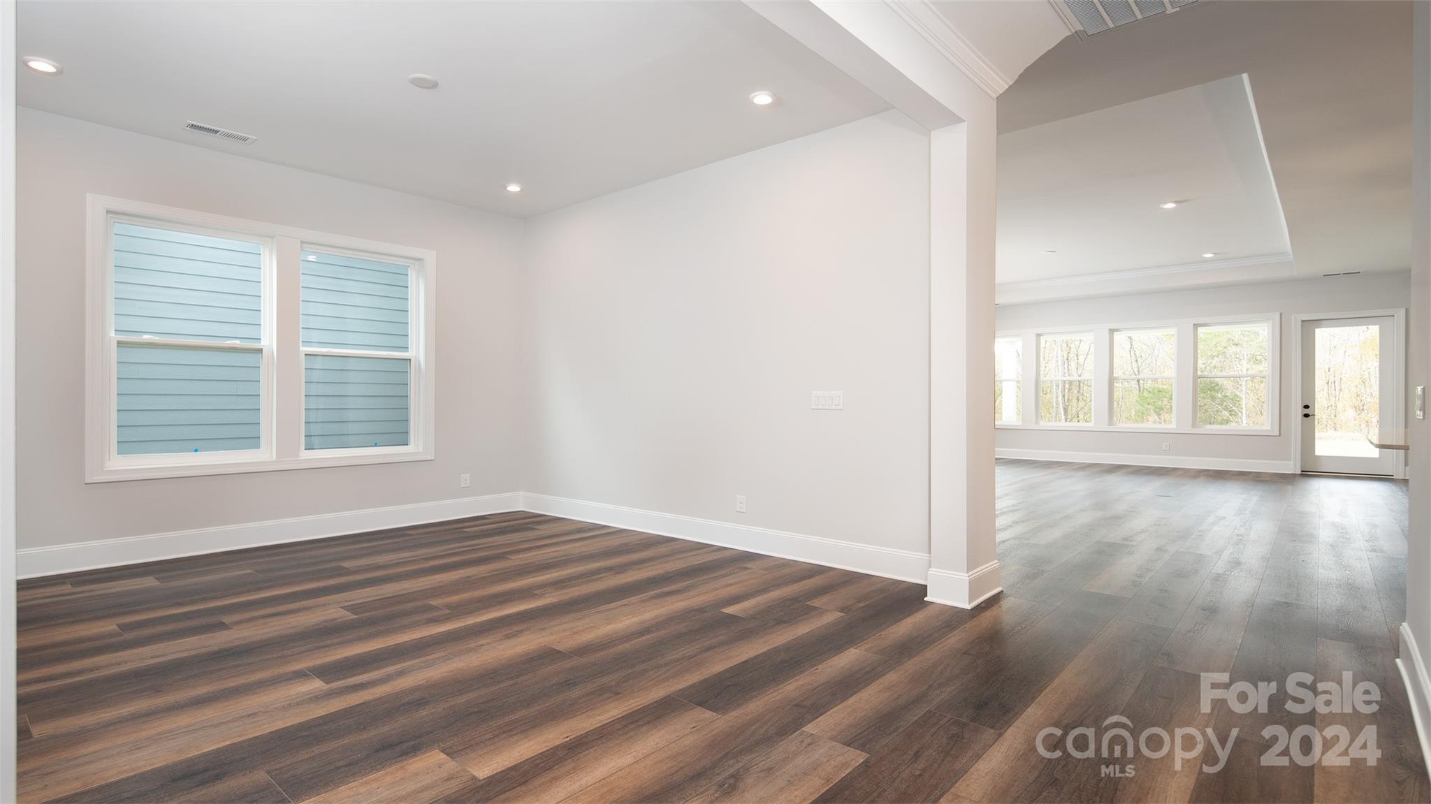 2002 Lake Como Drive Monroe, NC 28110 - Photo 18 of 40 a view of an empty room with wooden floor and a window