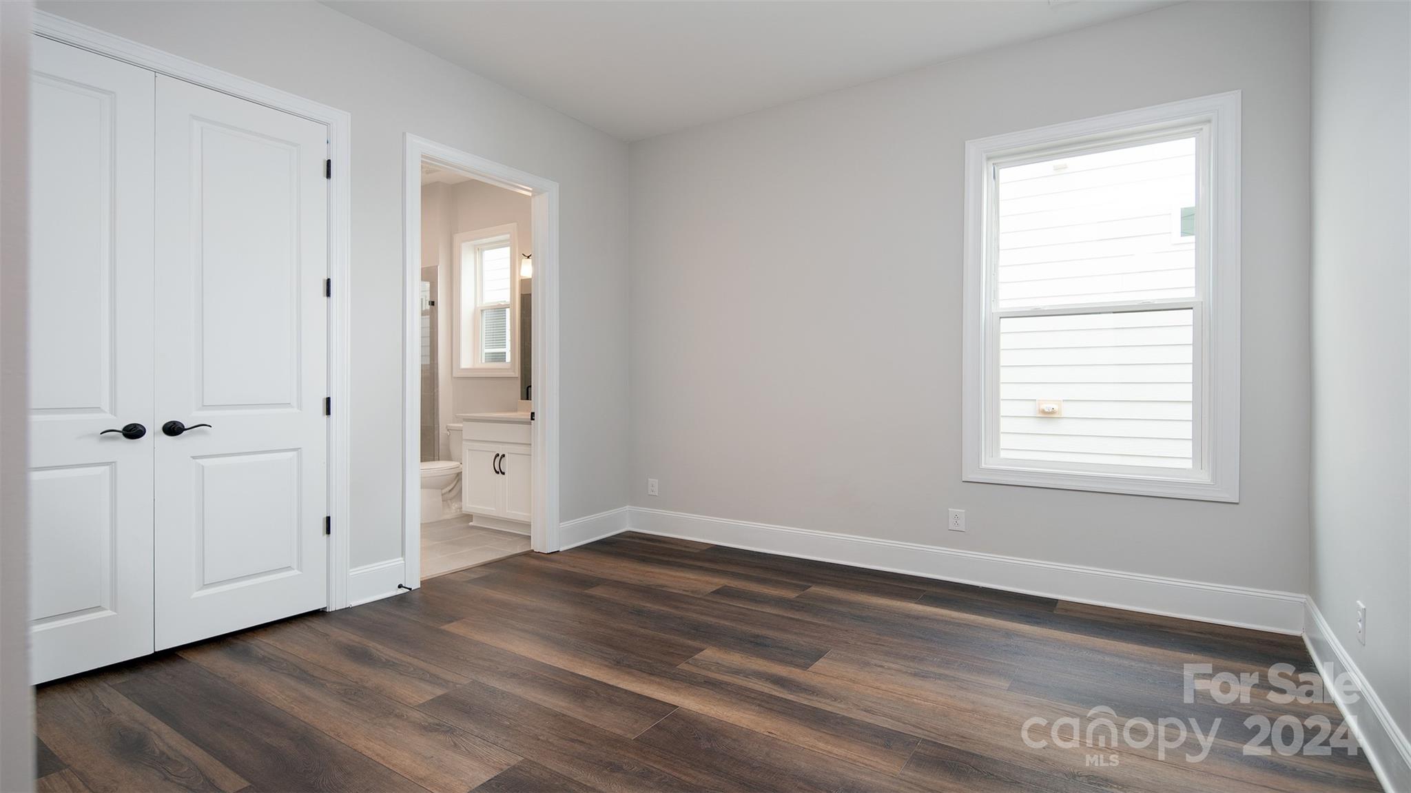 2002 Lake Como Drive Monroe, NC 28110 - Photo 19 of 40 a view of an empty room with wooden floor and a window