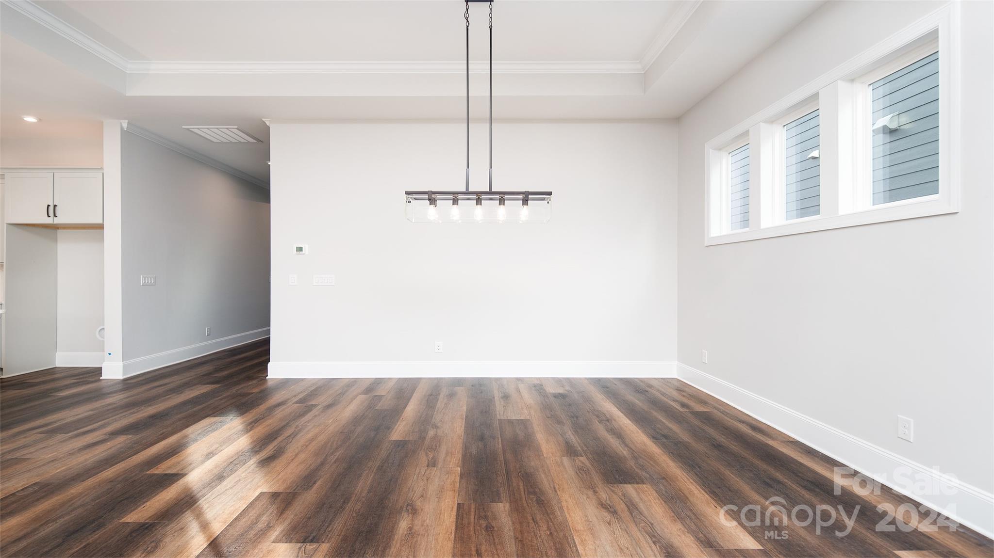 2002 Lake Como Drive Monroe, NC 28110 - Photo 21 of 40 a view of a room with wooden floor closet and a ceiling fan