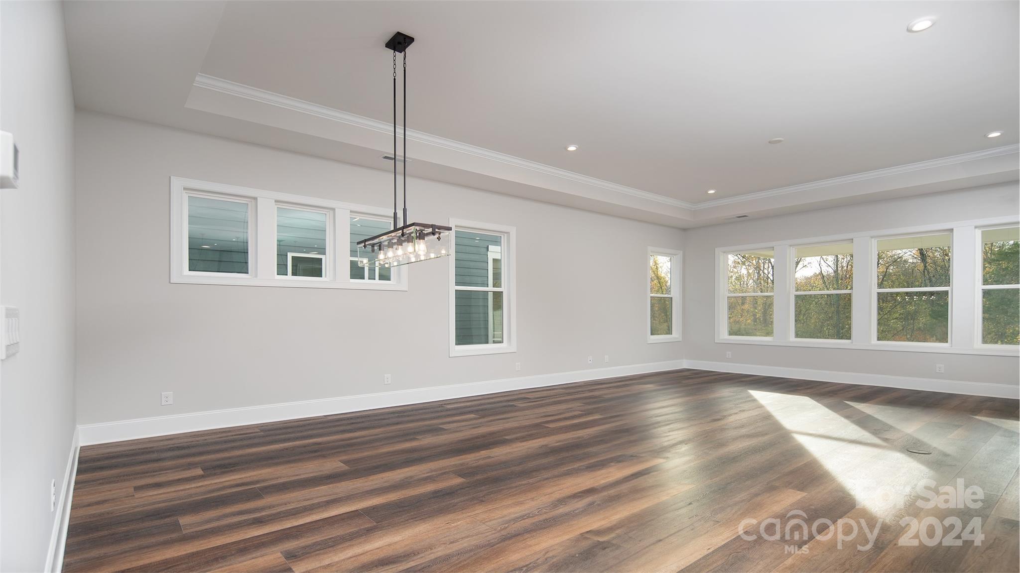 2002 Lake Como Drive Monroe, NC 28110 - Photo 30 of 40 a view of an empty room with a window and wooden floor