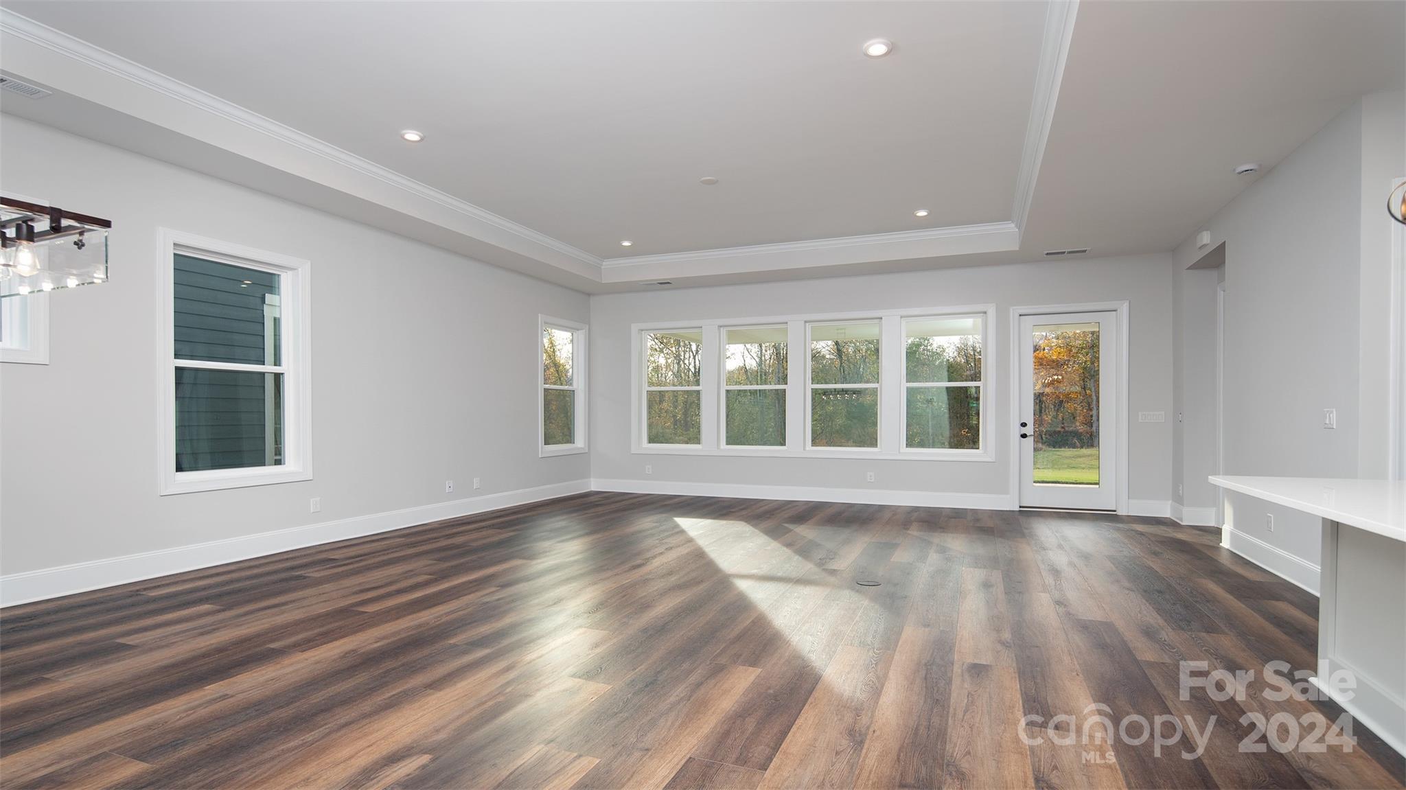 2002 Lake Como Drive Monroe, NC 28110 - Photo 31 of 40 a view of an empty room with wooden floor and a window