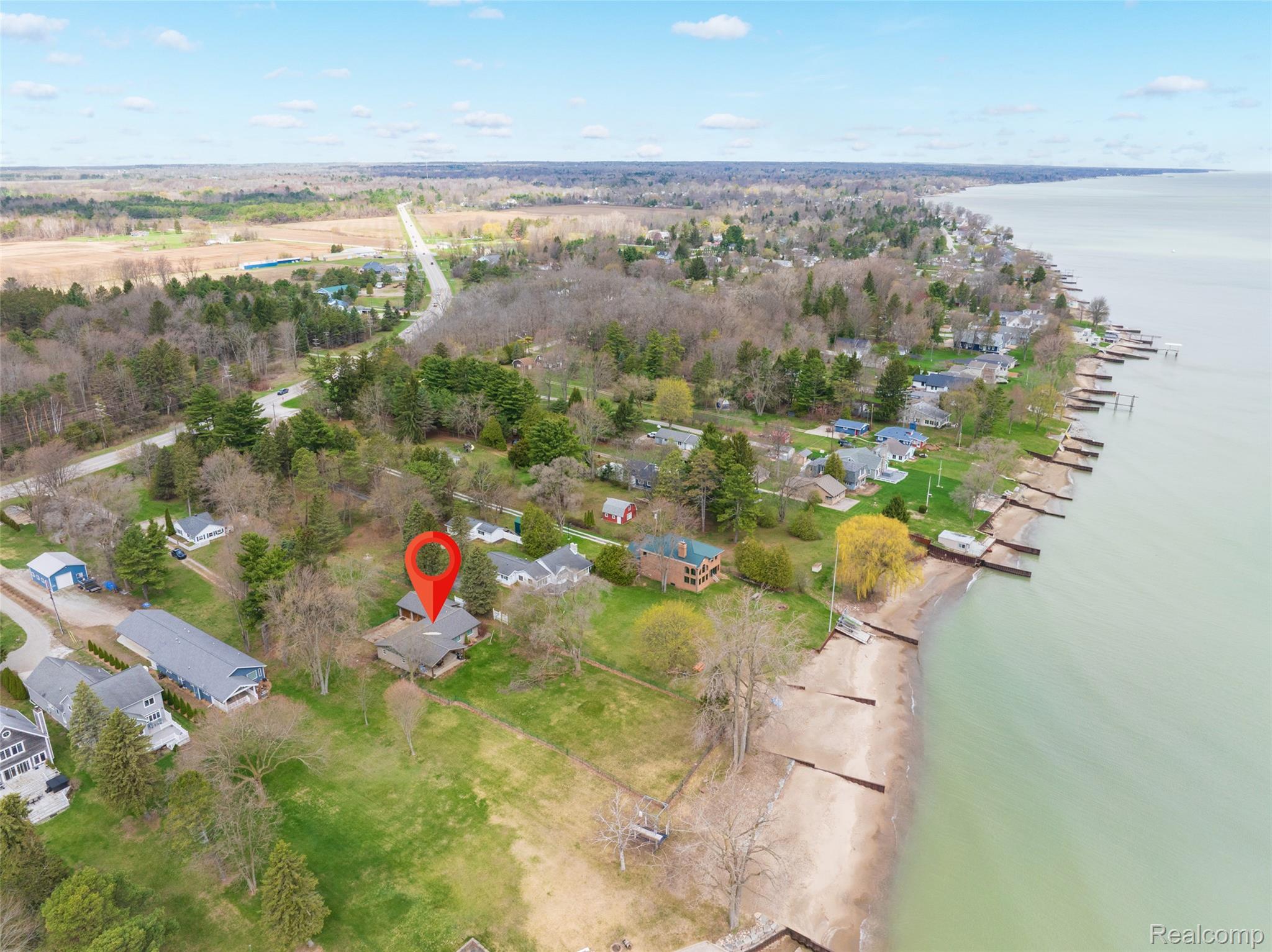 8171 Lakeshore Road Lexington, MI 48450 - Photo 45 of 45 Aerial perspective of suburban area with a large body of water