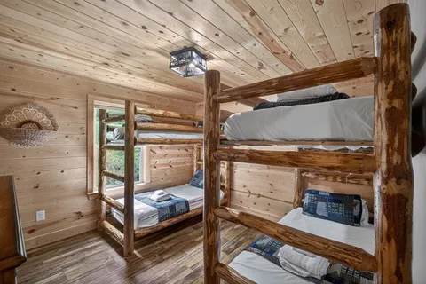 a view of a room with wooden floor