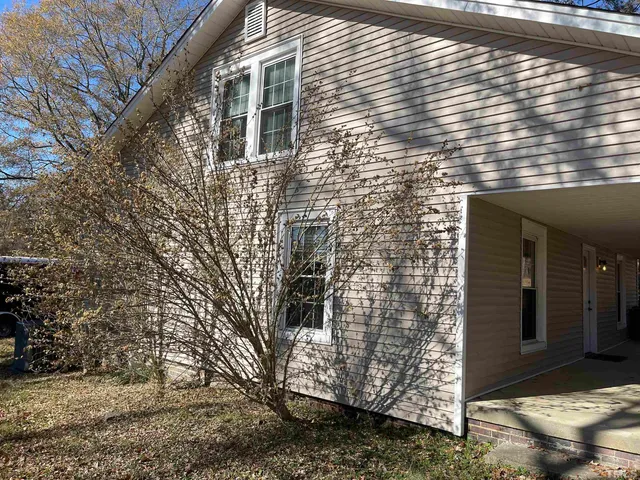 a brick building with a yard