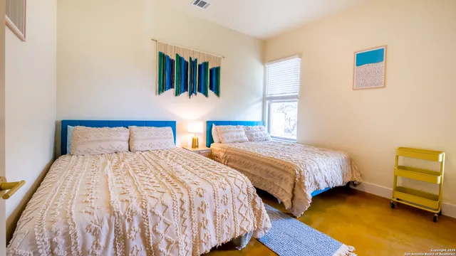 a bedroom with bed and window