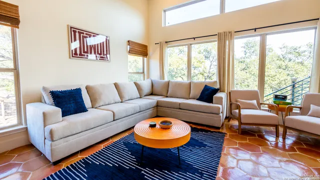 a living room with furniture and a large window