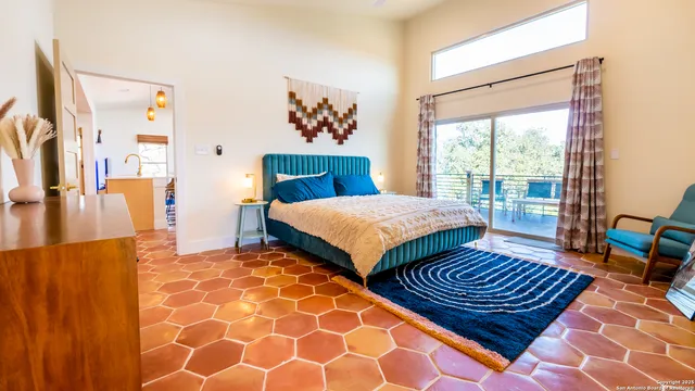 a bedroom with two beds and a dresser