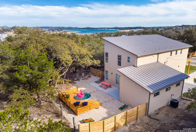 a terrace of a house with outdoor seating