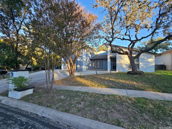 a view of house with a yard