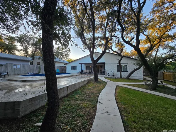 a house with trees in the background