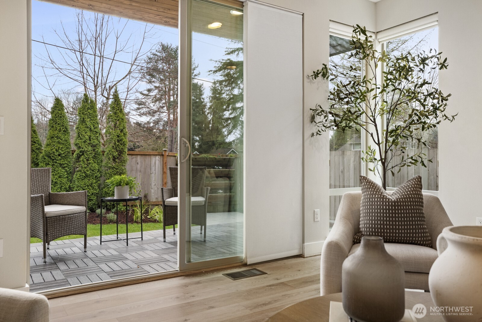 4526 327th Place Northeast Carnation, WA 98014 - Photo 11 of 36 a porch with a bench and a potted plant