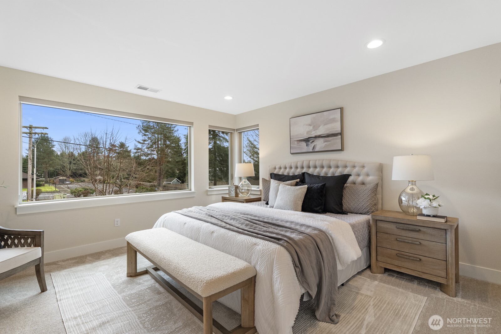 4526 327th Place Northeast Carnation, WA 98014 - Photo 16 of 36 a bedroom with a bed and a painting on the wall