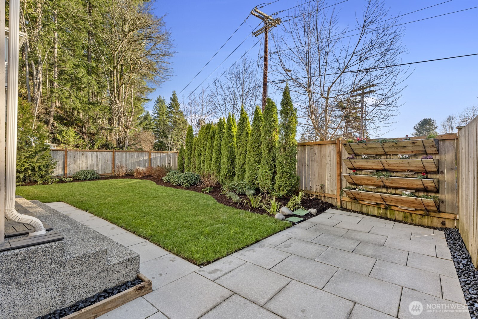 4526 327th Place Northeast Carnation, WA 98014 - Photo 28 of 36 a view of a chair and table in the back yard of the house
