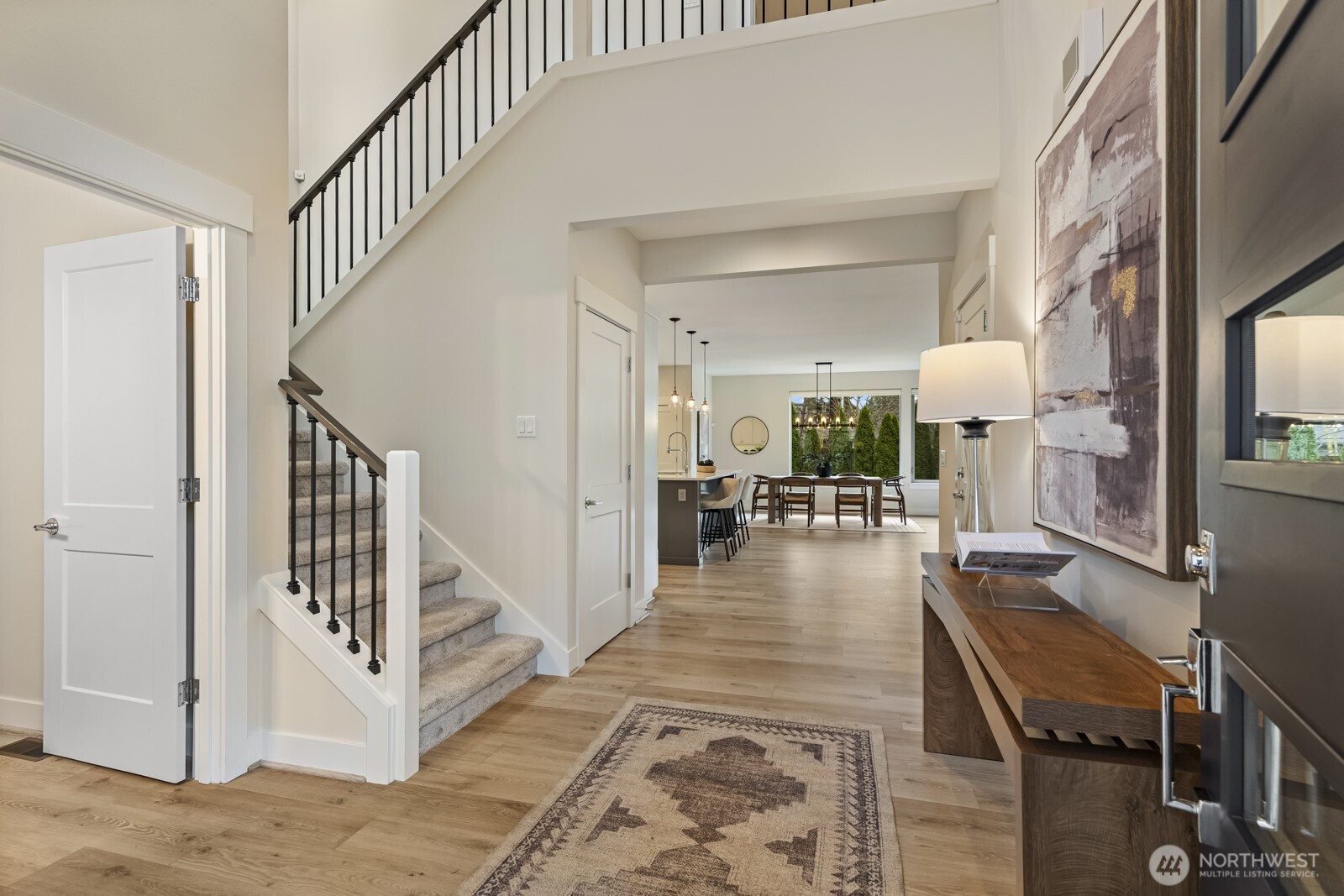 4526 327th Place Northeast Carnation, WA 98014 - Photo 3 of 36 a view of a hallway with dining room and furniture