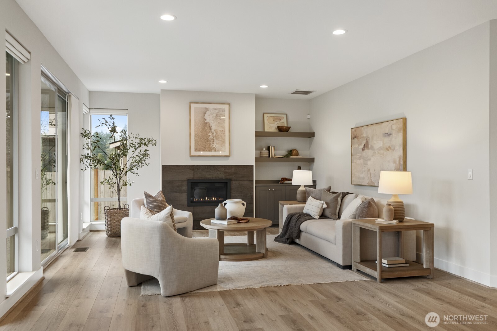 4526 327th Place Northeast Carnation, WA 98014 - Photo 10 of 36 a living room with furniture a fireplace and a potted plant