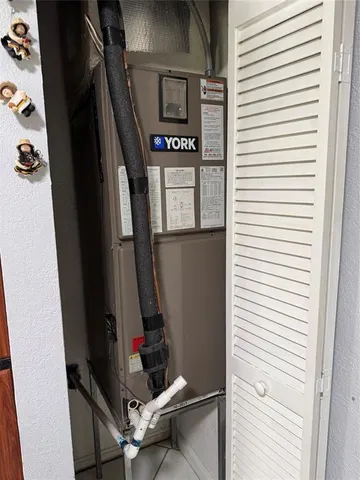 a work room with furniture and a window