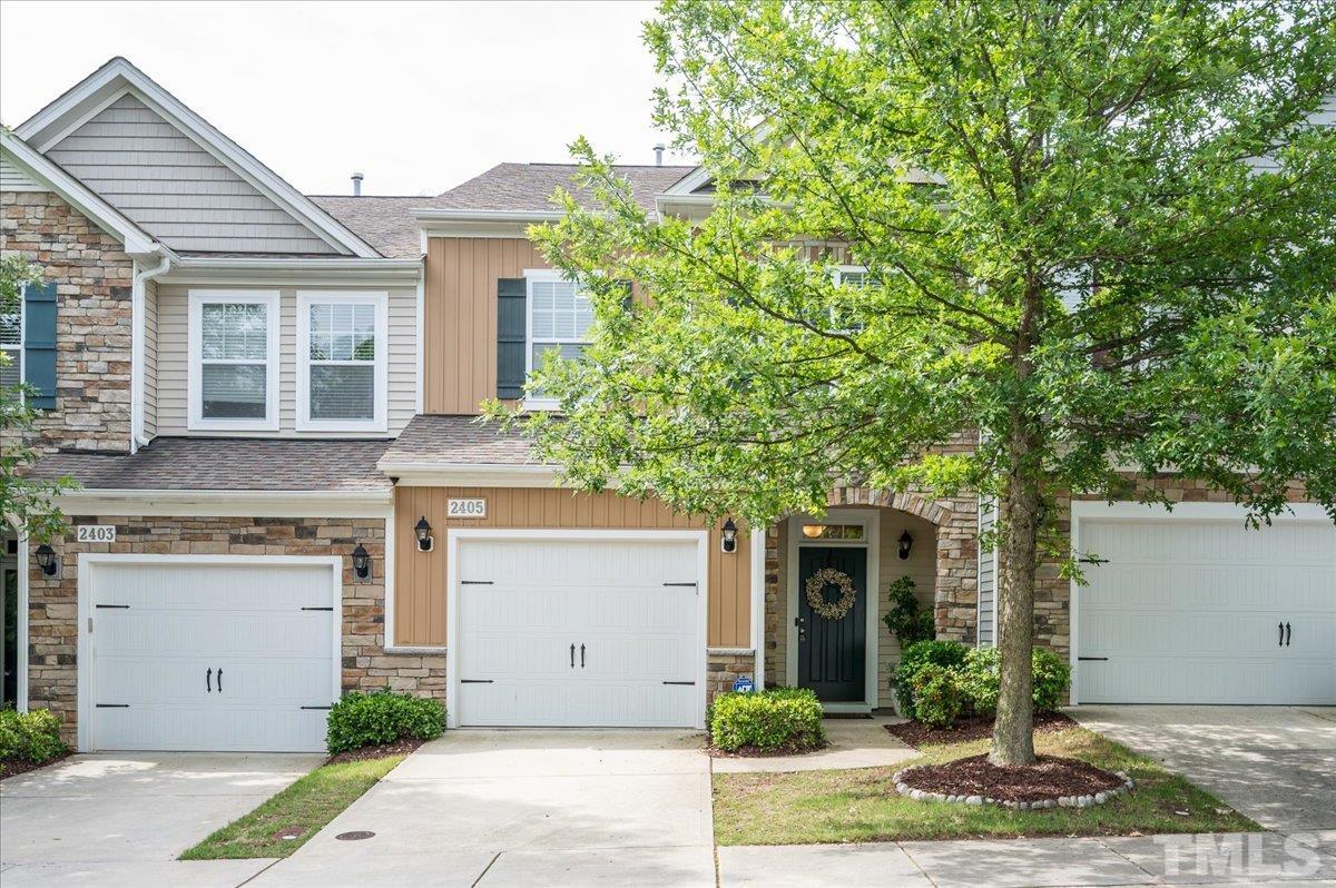 2405 Swans Rest Way Raleigh, NC 27606 - Photo 1 of 29 a front view of a house with garden