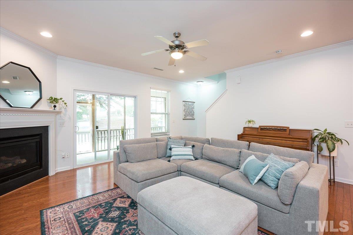 2405 Swans Rest Way Raleigh, NC 27606 - Photo 12 of 29 a living room with furniture and a fireplace