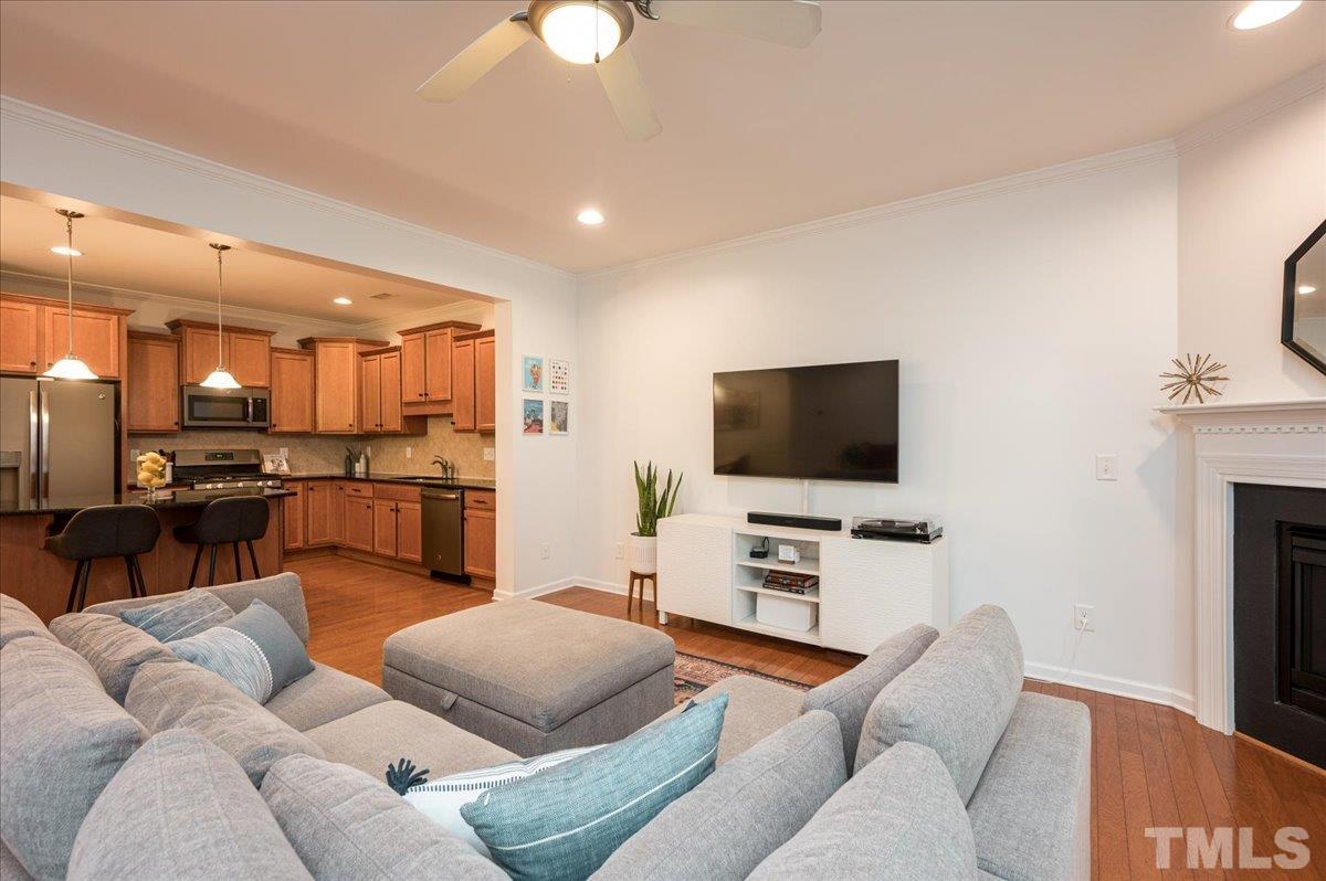 2405 Swans Rest Way Raleigh, NC 27606 - Photo 14 of 29 a living room with furniture and a flat screen tv
