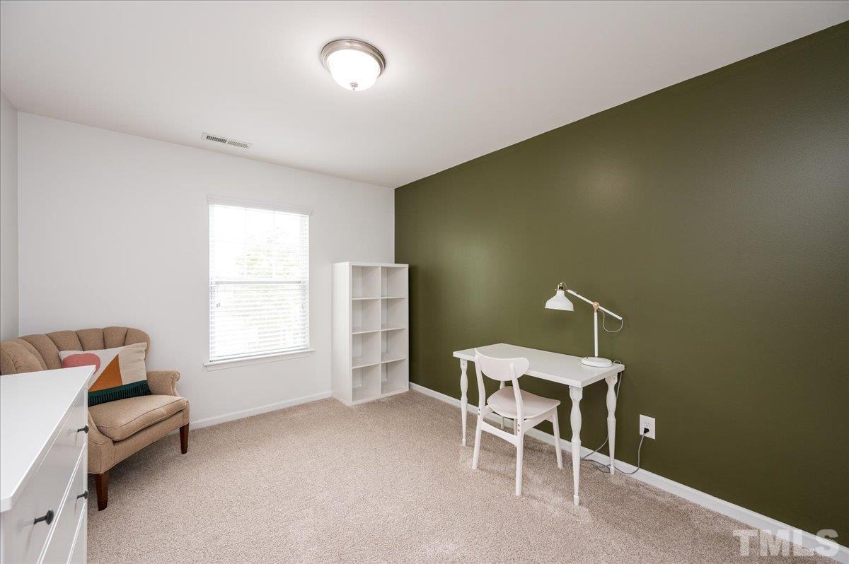 2405 Swans Rest Way Raleigh, NC 27606 - Photo 20 of 29 a dining room with furniture and a window