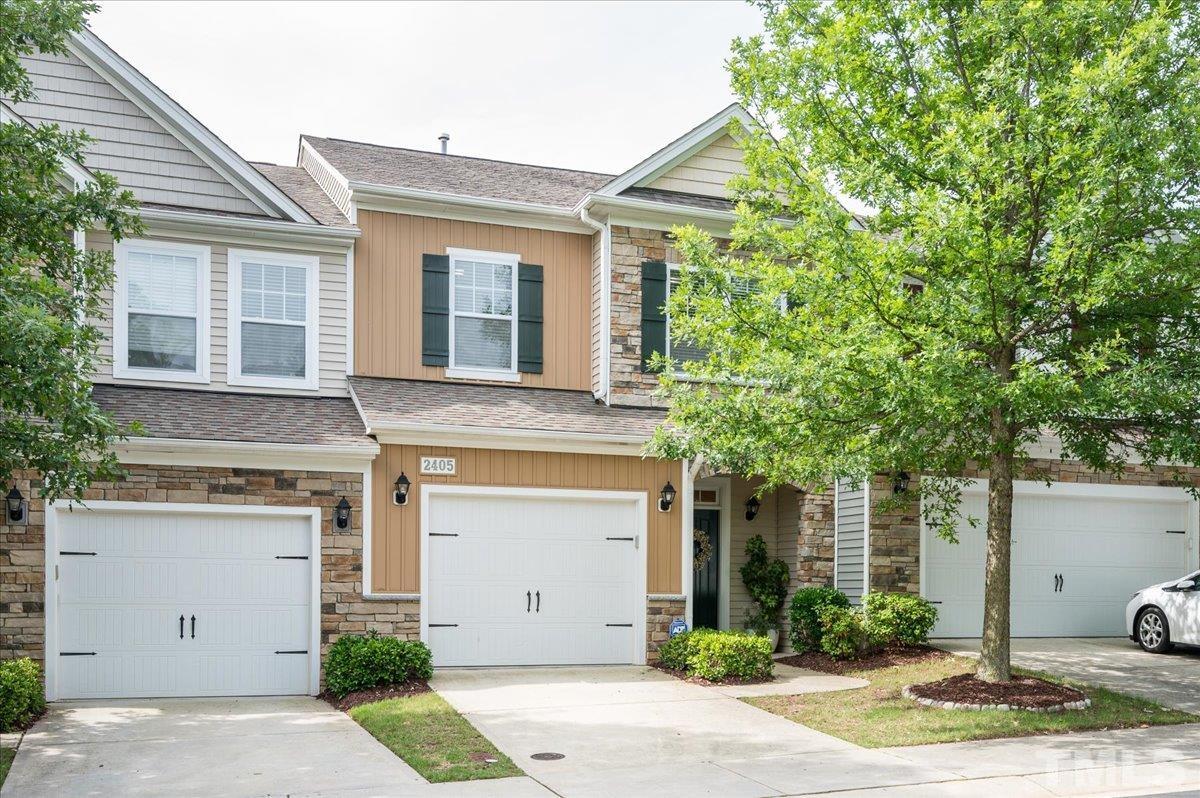 2405 Swans Rest Way Raleigh, NC 27606 - Photo 2 of 29 a front view of a house with garden