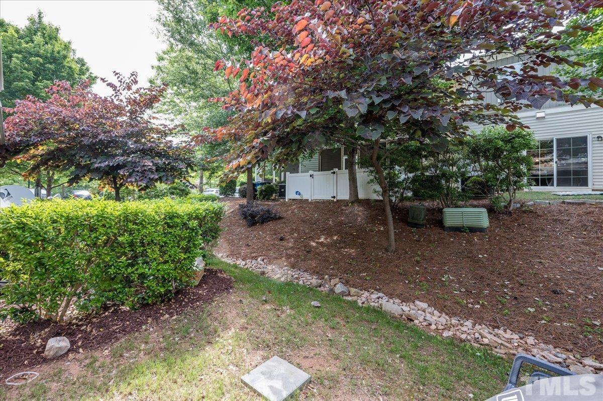 2405 Swans Rest Way Raleigh, NC 27606 - Photo 24 of 29 a view of a backyard with garden