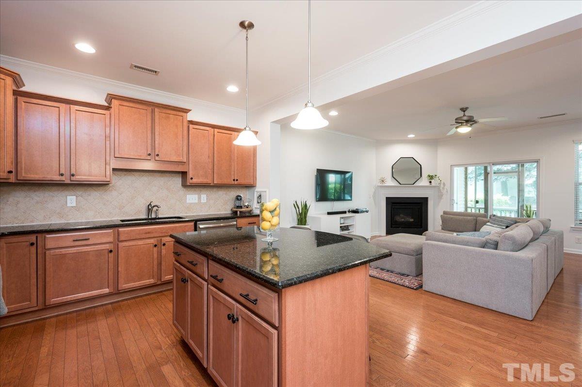 2405 Swans Rest Way Raleigh, NC 27606 - Photo 10 of 29 a kitchen with granite countertop a sink cabinets and window