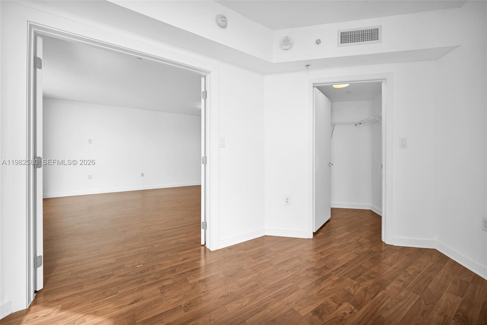 9055 Southwest 73rd Court, Unit 1104 Miami, FL 33156 - Photo 12 of 19 a view of a room with wooden floor