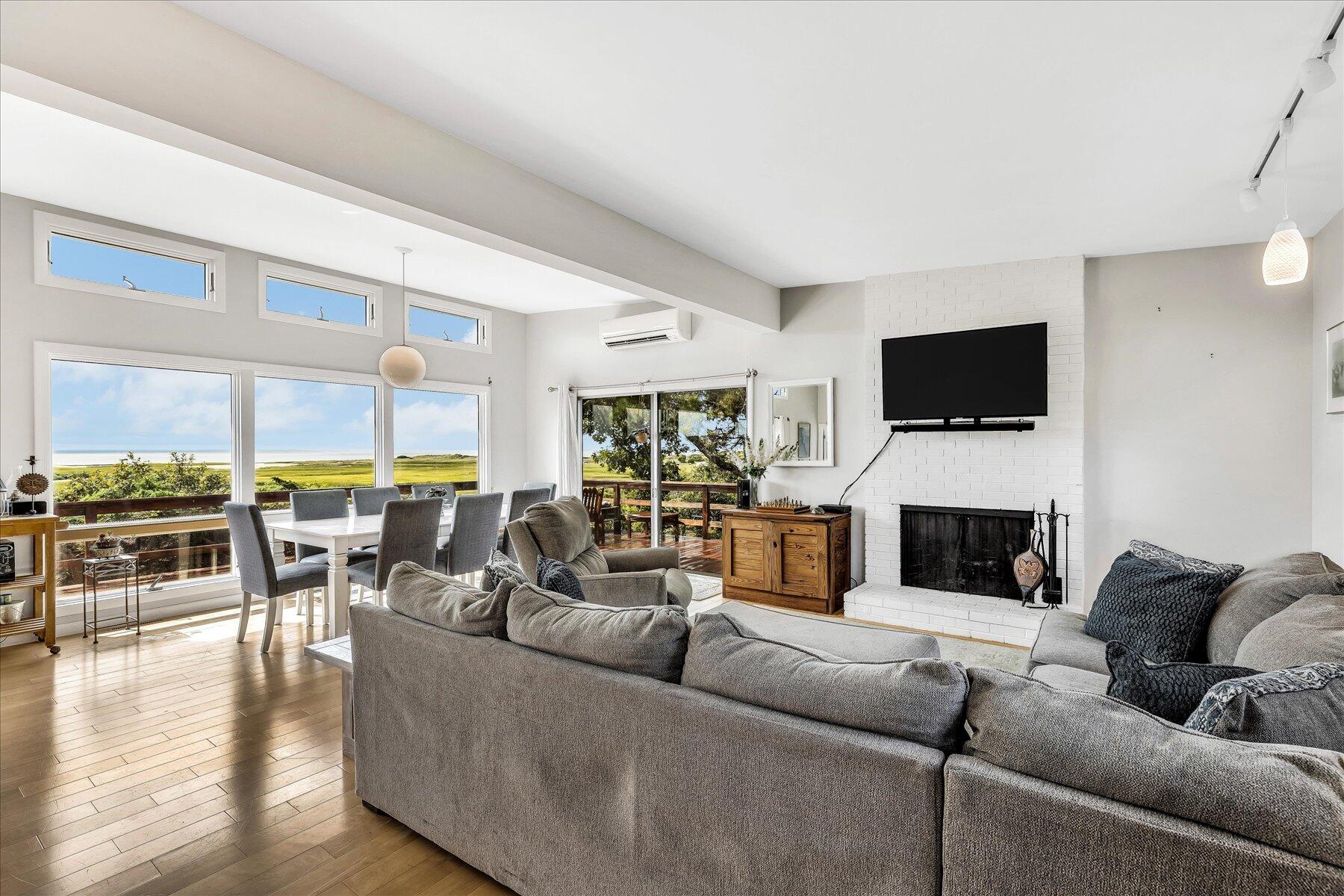 60 5th Avenue Wellfleet, MA 02667 - Photo 12 of 42 a living room with furniture fireplace and flat screen tv