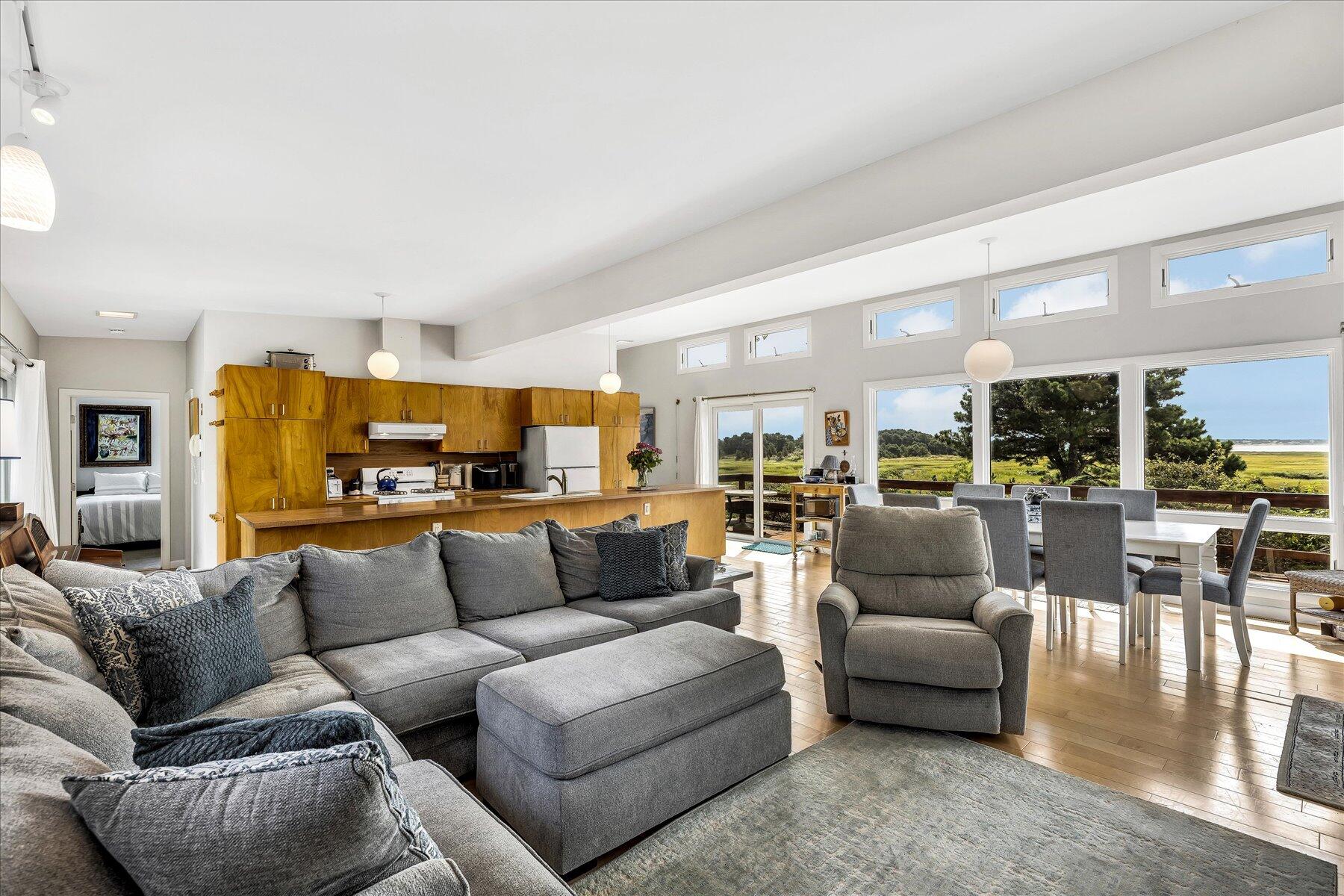 60 5th Avenue Wellfleet, MA 02667 - Photo 13 of 42 a living room with furniture kitchen view and a large window