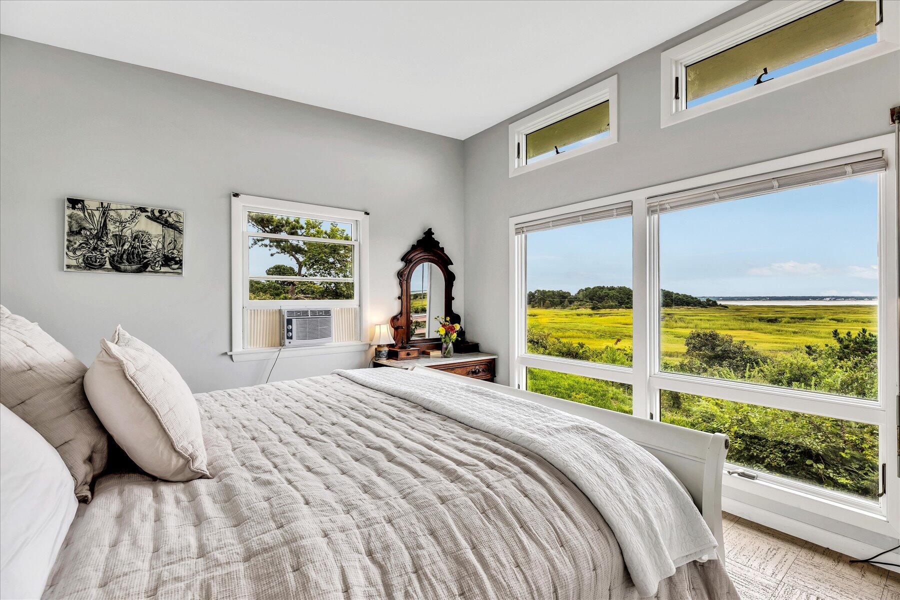 60 5th Avenue Wellfleet, MA 02667 - Photo 15 of 42 a bedroom with a bed and a large window