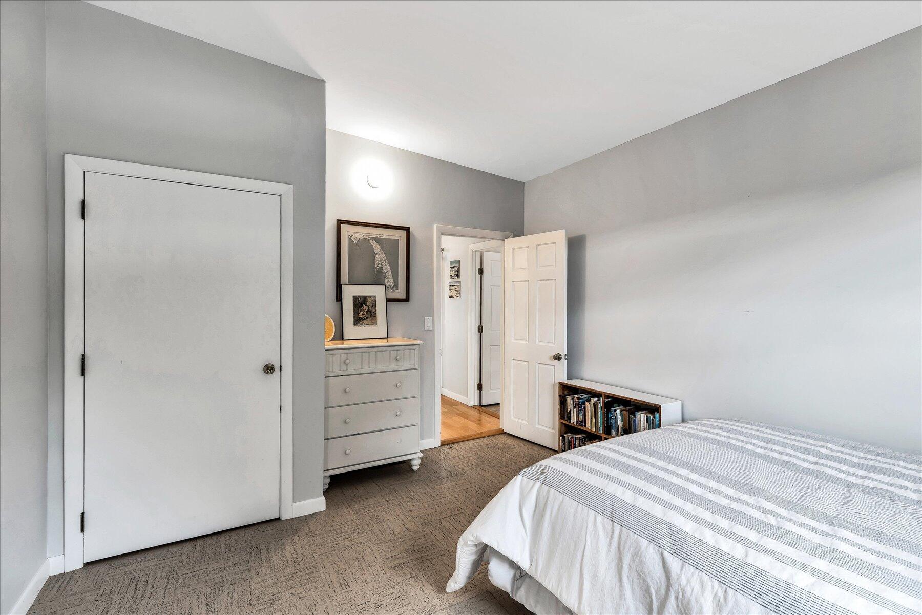 60 5th Avenue Wellfleet, MA 02667 - Photo 20 of 42 a bedroom with a bed and cabinets