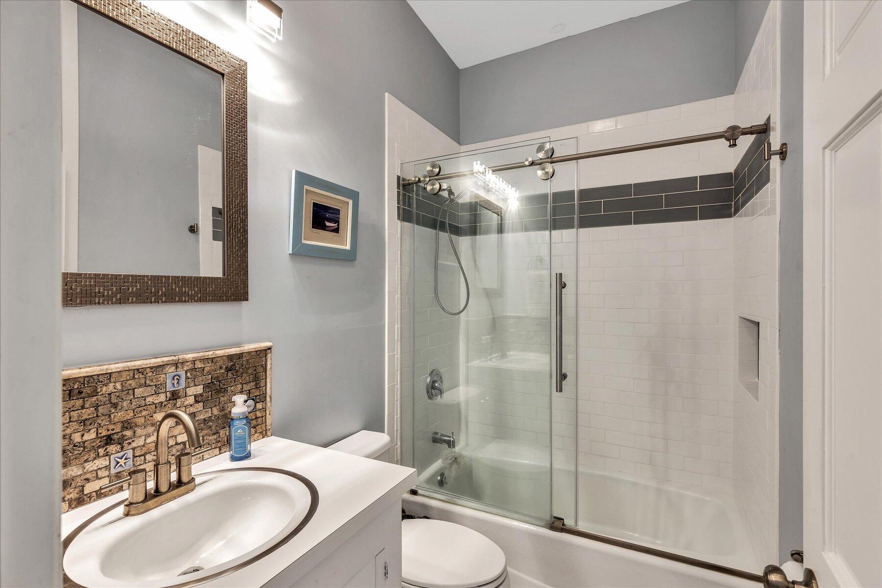 60 5th Avenue Wellfleet, MA 02667 - Photo 21 of 42 a bathroom with a sink toilet and shower