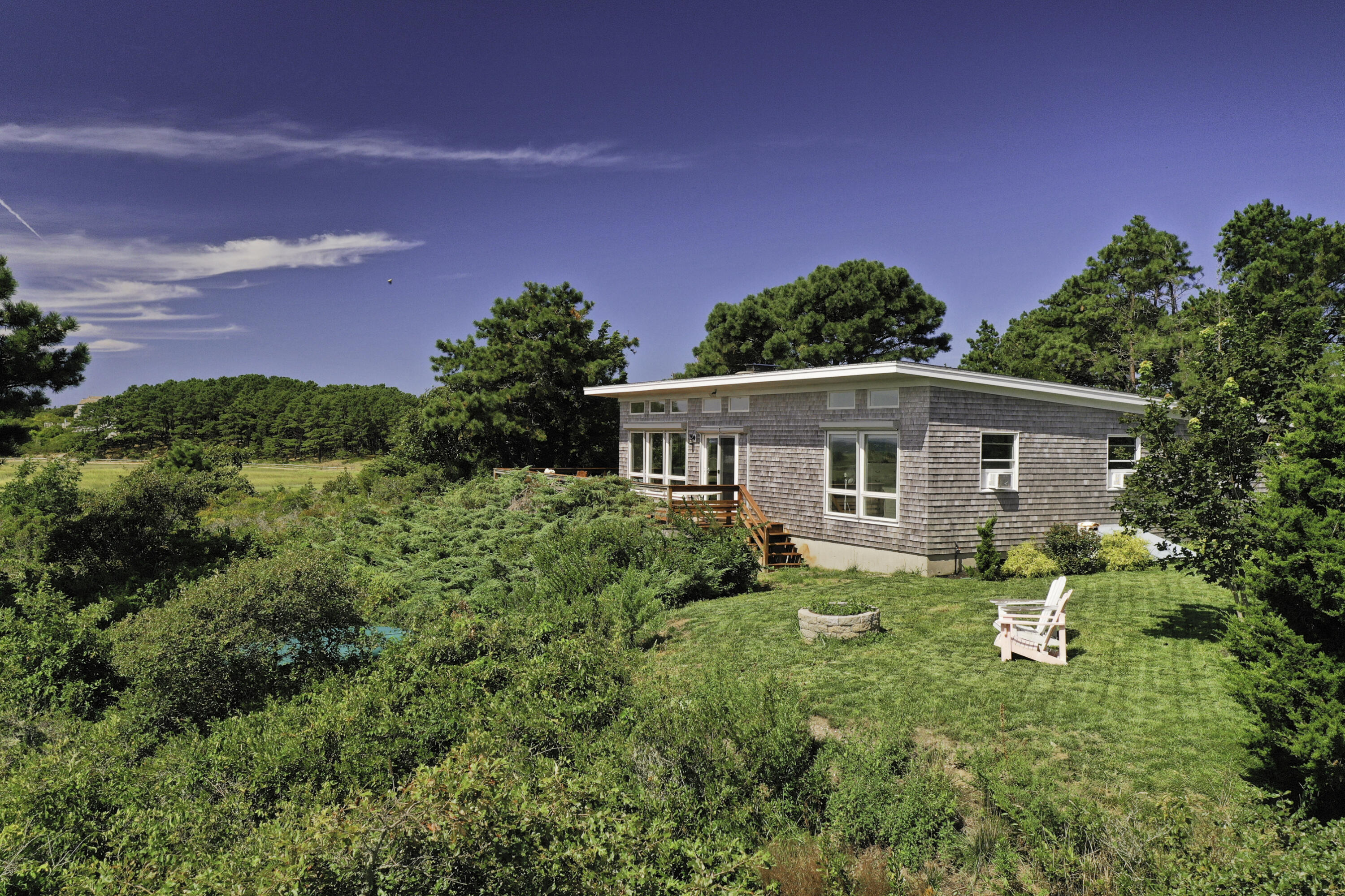 60 5th Avenue Wellfleet, MA 02667 - Photo 24 of 42 a front view of house with yard and green space