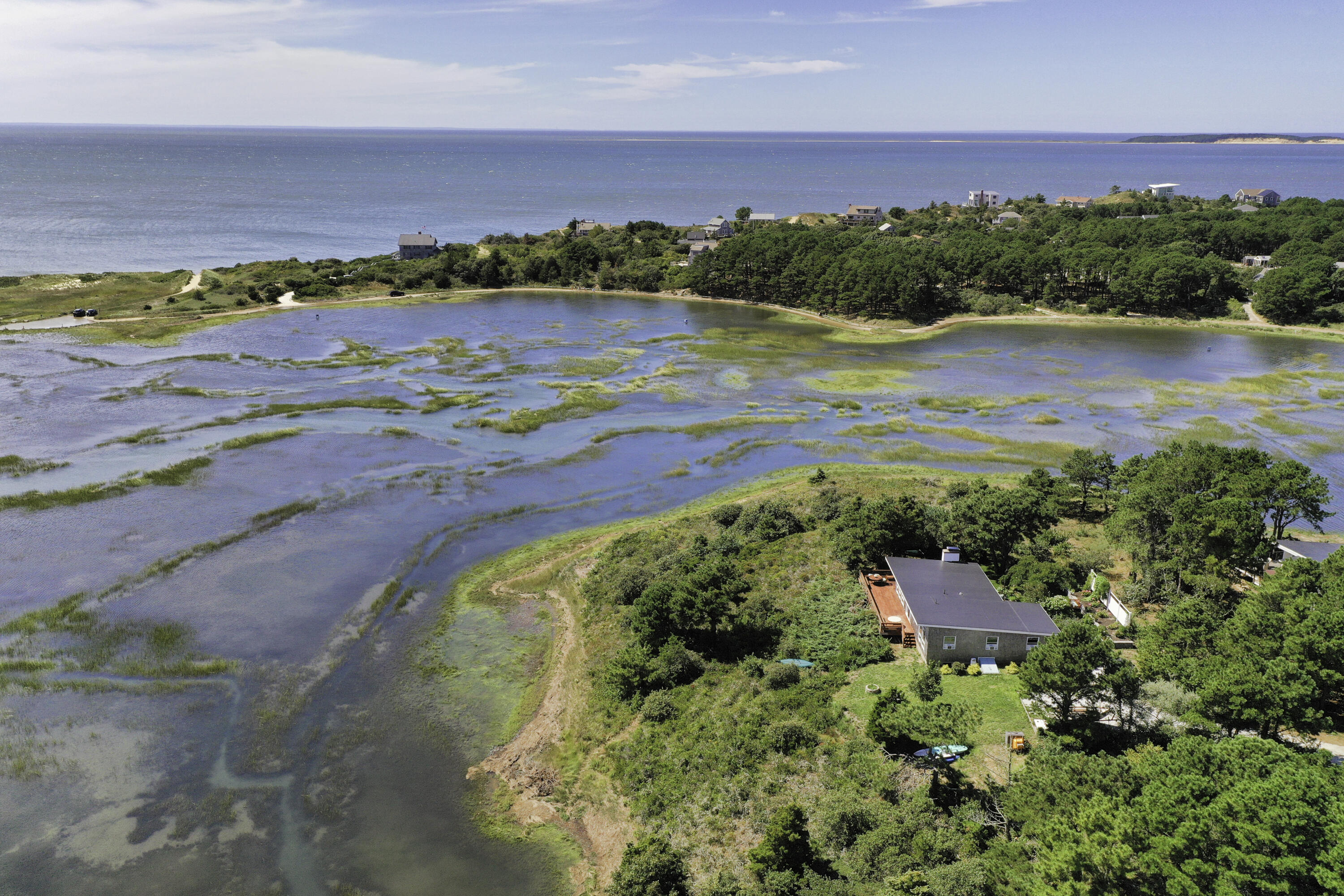 60 5th Avenue Wellfleet, MA 02667 - Photo 3 of 42 an aerial view of ocean beach and residential houses with outdoor space