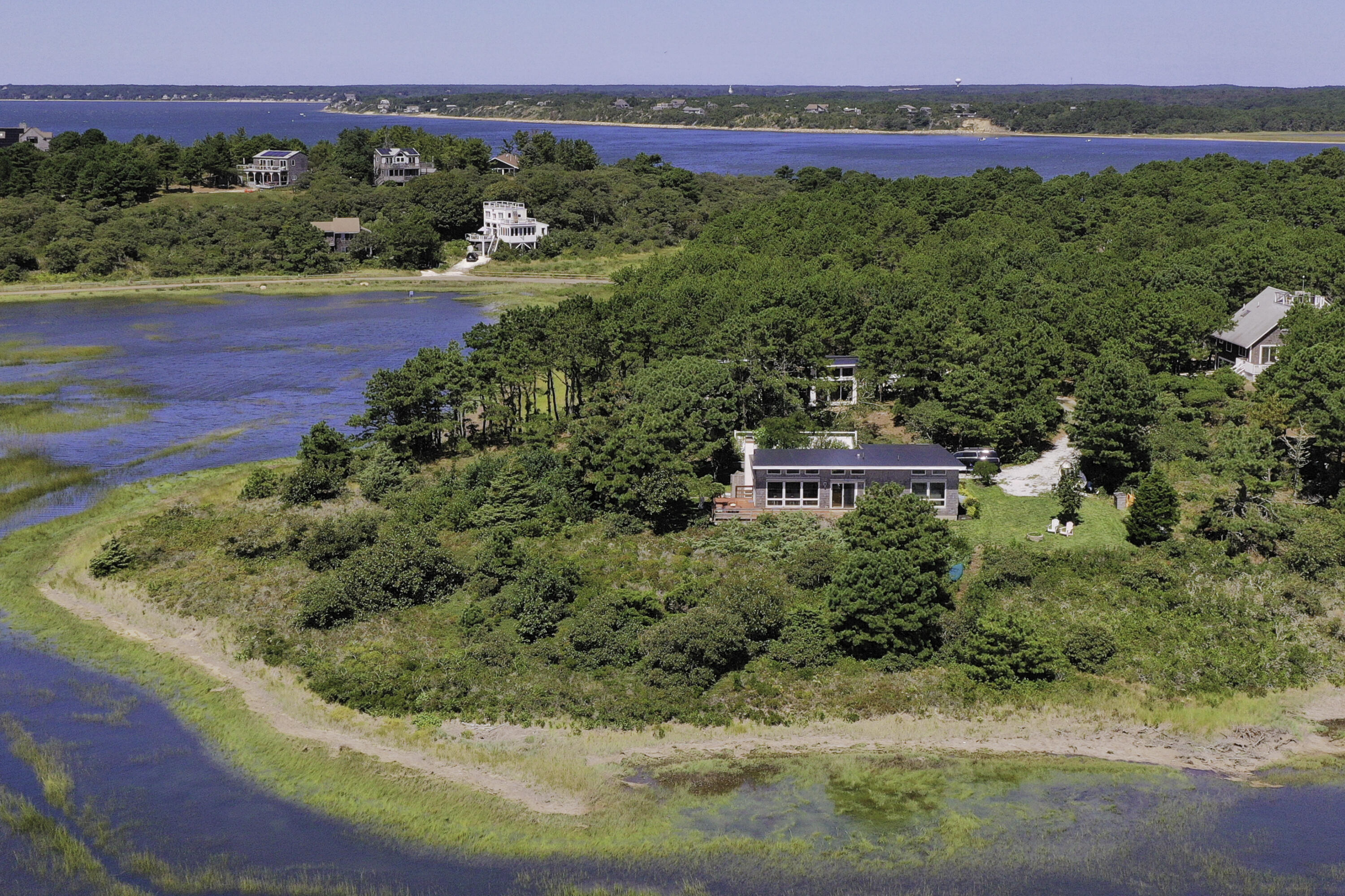 60 5th Avenue Wellfleet, MA 02667 - Photo 32 of 42 a view of a garden with a building in the background