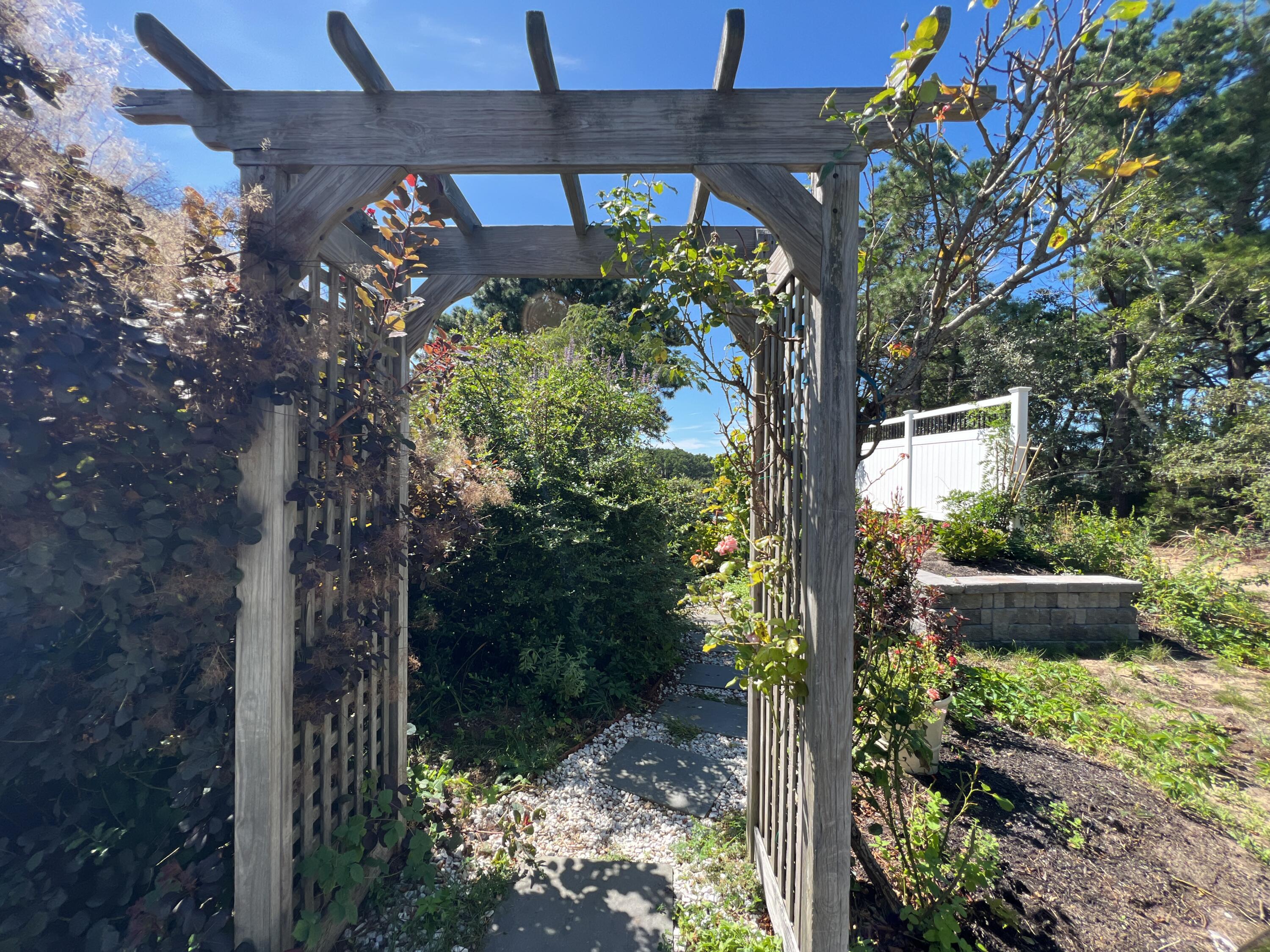 60 5th Avenue Wellfleet, MA 02667 - Photo 7 of 42 a backyard of a house with lots of green space
