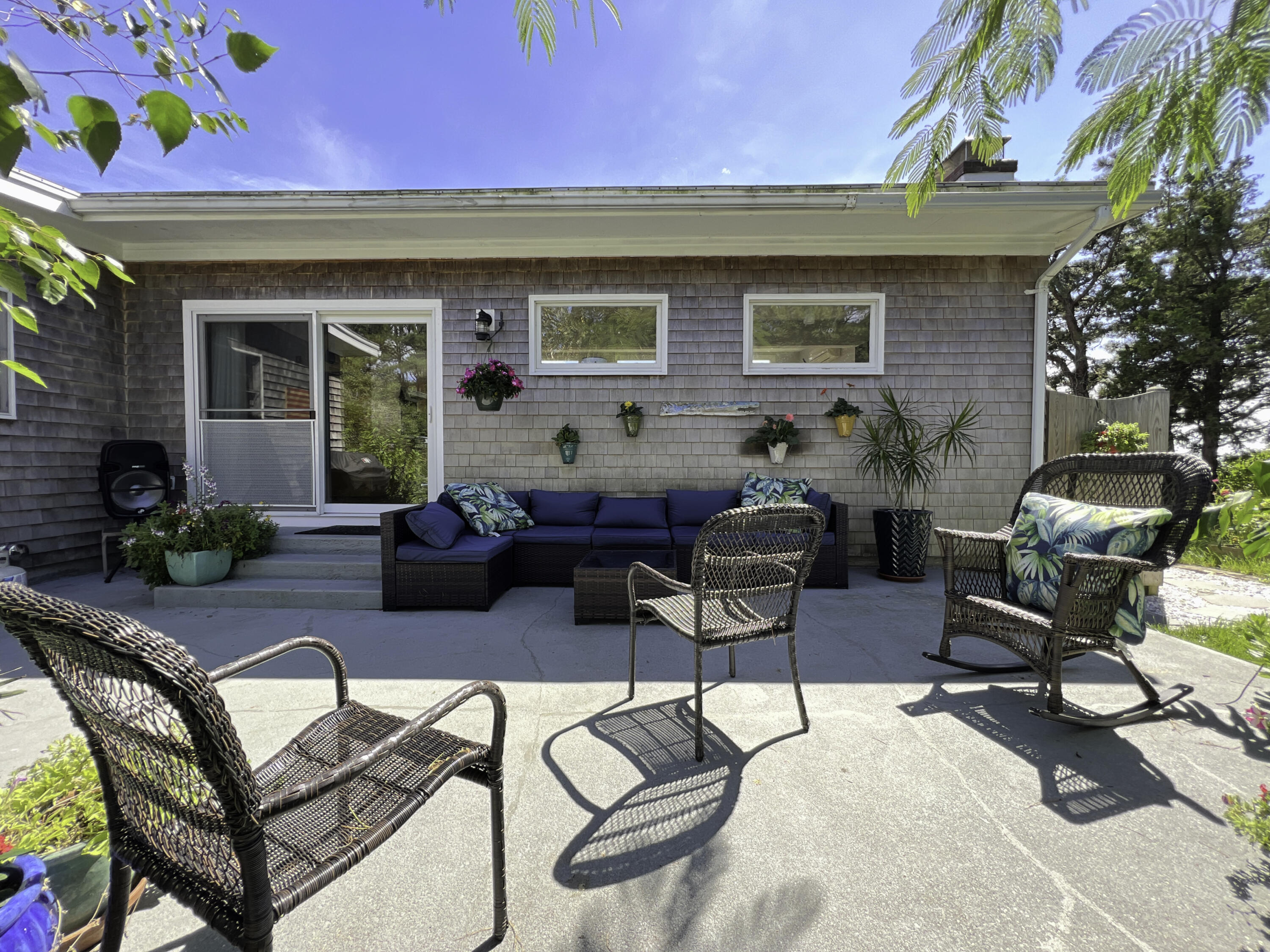 60 5th Avenue Wellfleet, MA 02667 - Photo 9 of 42 a backyard of a house with seating space